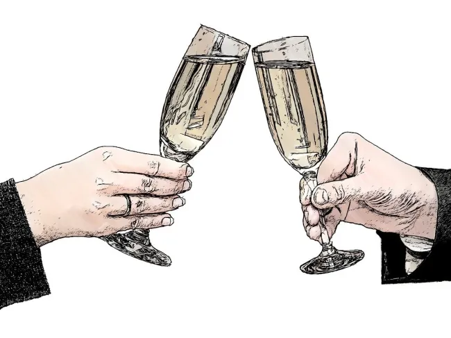 Two champagne glasses giving cheers